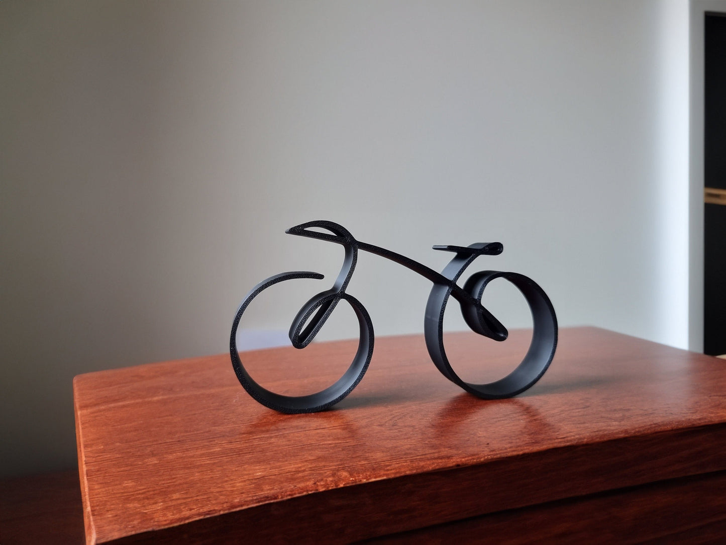 Owronline - Elegant minimalist bicycle sculpture wireframe style